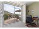 Office space with a large window overlooking an outdoor patio and desert landscape at 4903 S Desert Willow Dr, Gold Canyon, AZ 85118