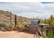 Built-in stainless steel BBQ grill with desert landscape in the background at 4903 S Desert Willow Dr, Gold Canyon, AZ 85118