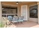 Covered patio with dining table and chairs, ceiling fan, and scenic views at 4903 S Desert Willow Dr, Gold Canyon, AZ 85118
