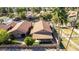 Birds eye view of a home featuring a tiled roof, palm trees and backyard patio at 5016 E Waltann Ln, Scottsdale, AZ 85254