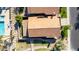 Aerial view of a home with a red tiled roof, showcasing the pool and green space at 5016 E Waltann Ln, Scottsdale, AZ 85254