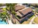 Overhead view of the property featuring a tiled roof, palm trees and manicured grass at 5016 E Waltann Ln, Scottsdale, AZ 85254