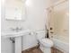 Bathroom featuring a pedestal sink, toilet and tub with shower at 5016 E Waltann Ln, Scottsdale, AZ 85254
