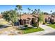 Aerial view of a well-landscaped home with a tile roof and mature palm trees at 5016 E Waltann Ln, Scottsdale, AZ 85254