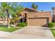 Single story home with an attached garage and well maintained landscaping at 5016 E Waltann Ln, Scottsdale, AZ 85254