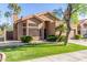Single-story home with desert landscaping, a two car garage and stucco exterior at 5016 E Waltann Ln, Scottsdale, AZ 85254