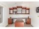 Home office with custom built-in desk, shelving, and drawers at 5016 E Waltann Ln, Scottsdale, AZ 85254