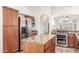 Well-equipped kitchen boasts stainless steel appliances and granite countertops at 5016 E Waltann Ln, Scottsdale, AZ 85254