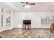 Spacious living room featuring tile floors, a ceiling fan, and ample natural light at 5016 E Waltann Ln, Scottsdale, AZ 85254