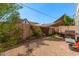 Relaxing backyard featuring desert landscaping with gravel, patio area with awning, and privacy wall at 5206 N 16Th Dr, Phoenix, AZ 85015