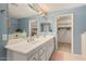 Bright bathroom with double sinks, vanity, and a large mirror at 5206 N 16Th Dr, Phoenix, AZ 85015