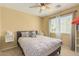 Cozy bedroom with a ceiling fan, natural light, and neutral decor at 5206 N 16Th Dr, Phoenix, AZ 85015