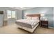 Comfortable bedroom with hardwood headboard, side tables and soft lighting at 5206 N 16Th Dr, Phoenix, AZ 85015