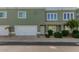 Attractive townhome featuring a two-car garage and desert landscaping at 5206 N 16Th Dr, Phoenix, AZ 85015