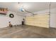 Clean garage offering space for parking and storage, featuring a roll-up door and overhead lighting at 5206 N 16Th Dr, Phoenix, AZ 85015