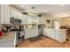 Bright kitchen featuring white cabinetry, stainless steel appliances, and a window providing ample natural light at 5206 N 16Th Dr, Phoenix, AZ 85015