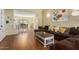 Inviting living room features hardwood floors and open floorplan into dining area at 5206 N 16Th Dr, Phoenix, AZ 85015