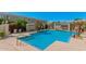 Community pool offering a refreshing escape and a gathering spot for residents with lounge area and seating at 5206 N 16Th Dr, Phoenix, AZ 85015