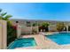 Inviting community pool and spa area, perfect for relaxation and recreation, surrounded by lush greenery at 5206 N 16Th Dr, Phoenix, AZ 85015