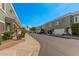 Street view of multi-Gathering homes, with attached garages and neutral colored paint, complemented by well-maintained landscaping at 5206 N 16Th Dr, Phoenix, AZ 85015