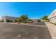 View of well-maintained condos featuring desert landscaping and individual garages, blending seamlessly with the natural surroundings at 5206 N 16Th Dr, Phoenix, AZ 85015