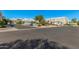 Charming condos with private garages line a landscaped street, offering comfortable and convenient living in a desirable neighborhood at 5206 N 16Th Dr, Phoenix, AZ 85015