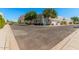 Wide street view showcasing the community's well-maintained exteriors and landscaping with ample parking at 5206 N 16Th Dr, Phoenix, AZ 85015