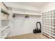 Spacious walk-in closet with built-in shelving and hanging rods for optimal organization and storage solutions at 5206 N 16Th Dr, Phoenix, AZ 85015