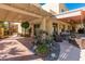 Inviting backyard featuring lush landscaping, stone walkways, a covered patio, and comfortable seating for outdoor relaxation at 5340 W Turquoise Ave, Glendale, AZ 85302