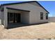 View of the side and back of the house with covered patio at 5519 S 240Th Ln, Buckeye, AZ 85326