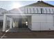 New construction home with sliding glass doors opening to a patio at 5519 S 240Th Ln, Buckeye, AZ 85326