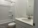 Bright bathroom with a tub shower, white vanity and countertop, and brushed silver fixtures at 5519 S 240Th Ln, Buckeye, AZ 85326