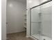 Tiled shower and shelves inside ensuite bathroom at 5519 S 240Th Ln, Buckeye, AZ 85326