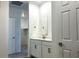 Ensuite bathroom with double sink vanity and closet at 5519 S 240Th Ln, Buckeye, AZ 85326