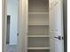Bright closet with ample shelving for optimal storage at 5519 S 240Th Ln, Buckeye, AZ 85326