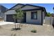Charming single-story home featuring neutral paint, a two car garage and simple landscaping at 5519 S 240Th Ln, Buckeye, AZ 85326