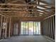 Interior view of framed room with ceiling supports and a sliding glass door at 5519 S 240Th Ln, Buckeye, AZ 85326