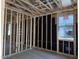 Framed interior view of an unfinished bedroom showing window and electrical at 5519 S 240Th Ln, Buckeye, AZ 85326