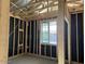 Framed interior view of a room showing the window placement, plumbing and electrical at 5519 S 240Th Ln, Buckeye, AZ 85326