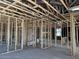 Framed new construction living room with open floor plan and exposed ceiling at 5519 S 240Th Ln, Buckeye, AZ 85326