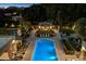 Expansive property aerial view featuring a pool, manicured lawns, gazebo, and mature trees, creating a luxurious outdoor oasis at 6402 E Chaparral Rd, Paradise Valley, AZ 85253