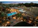 Backyard with a sparkling pool, an outdoor seating area, a patio with dining, and mature landscaping at 6402 E Chaparral Rd, Paradise Valley, AZ 85253