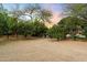 Lush backyard featuring a serene landscape with fruit trees and greenery, creating a peaceful outdoor retreat at 6402 E Chaparral Rd, Paradise Valley, AZ 85253