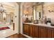 Elegant bathroom with custom vanity, stone countertop, and stylish lighting fixtures, creating a spa-like retreat at 6402 E Chaparral Rd, Paradise Valley, AZ 85253