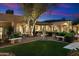 Serene courtyard with manicured lawn, benches, and statue, perfect for quiet reflection and enjoying the outdoors at 6402 E Chaparral Rd, Paradise Valley, AZ 85253
