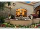 Charming fountain and flower garden at the property's entrance, adding to the home's curb appeal at 6402 E Chaparral Rd, Paradise Valley, AZ 85253