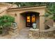 Inviting front entrance featuring decorative plants and a view into a stylishly decorated interior at 6402 E Chaparral Rd, Paradise Valley, AZ 85253