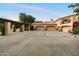 A large driveway and three-car garage enhance this home's curb appeal, providing ample parking and storage space at 6402 E Chaparral Rd, Paradise Valley, AZ 85253