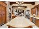 Open kitchen showcases large island, brick accents, custom cabinetry, and open floor plan at 6402 E Chaparral Rd, Paradise Valley, AZ 85253