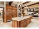 Luxury kitchen with oversized island, professional appliances, and custom refrigerator at 6402 E Chaparral Rd, Paradise Valley, AZ 85253